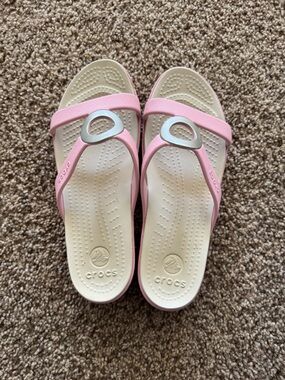 CROCS Pink Strap Sandals with Cream Footbed and Silver Accent